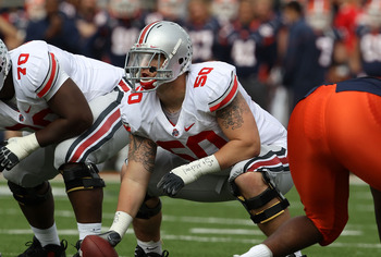 CHAMPAIGN, IL - OCTOBER 02: Mike Brewster #50 of the Ohio State Buckeyes waits to snap the ball against the Illinois Fighting Illini at Memorial Stadium on October 2, 2010 in Champaign, Illinois. Ohio State defeated Illinois 24-13.  (Photo by Jonathan Dan