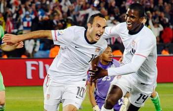 PRETORIA, SOUTH AFRICA - JUNE 23:  Landon Donovan of the United States celebrates with teammate Edson Buddle after scoring the winning goal that sends the USA through to the second round during the 2010 FIFA World Cup South Africa Group C match between US