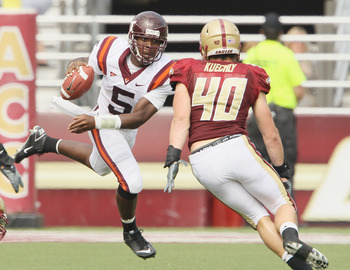 CHESTNUT HILL, MA - SEPTEMBER 25:  Tyrod Taylor #5 of the Virginia Tech Hokies scrambles with the ball as Luke Kuechly #40 of the Boston College Eagles defends on September 25, 2010 at Alumni Stadium in Chestnut Hill, Massachusetts.  (Photo by Elsa/Getty 