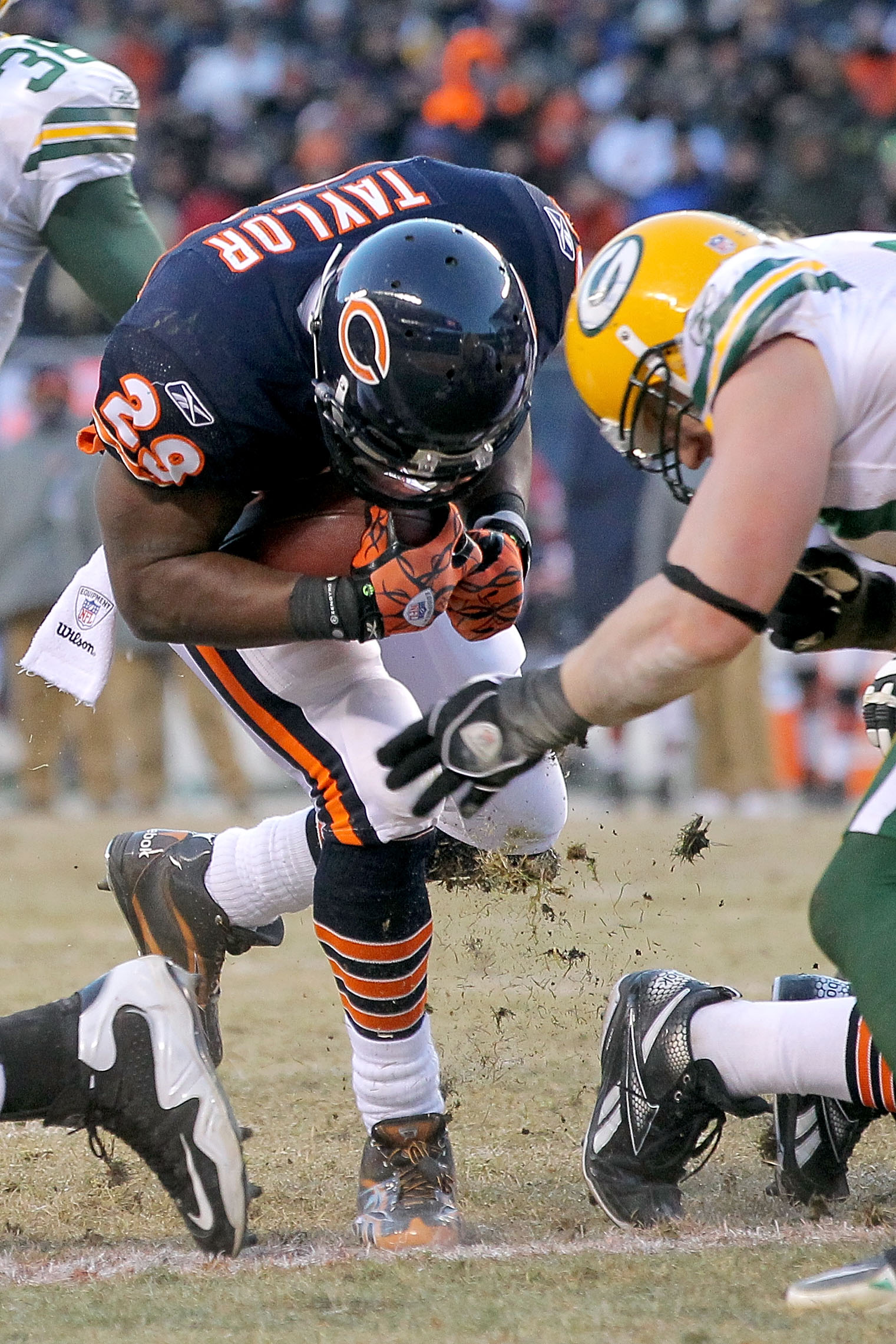 CHICAGO, IL - JANUARY 23:  Running back Chester Taylor #29 of the Chicago Bears scores a one-yard fourth quarter touchdown against the Green Bay Packers in the NFC Championship Game at Soldier Field on January 23, 2011 in Chicago, Illinois.  (Photo by Dou