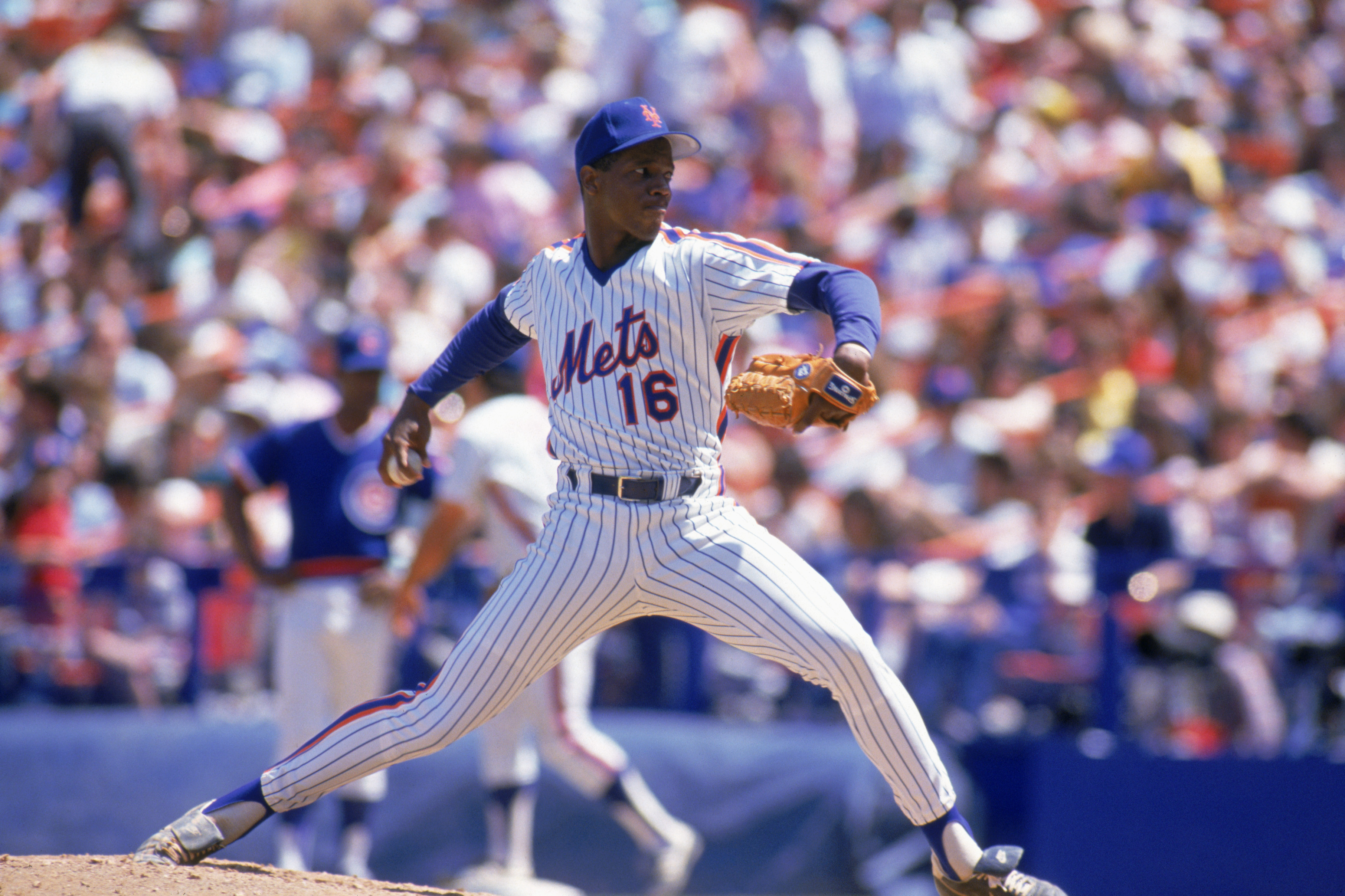 FLUSHING, NY - UNDATED:  Dwight Gooden #16 of the New York Mets delivers a pitch during a game at Shea Stadium circa 1984-1994 in Flushing, New York.  (Photo by Scott Halleran/Getty Images)