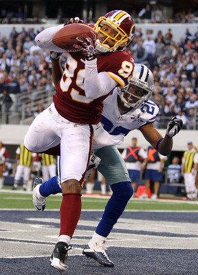 ARLINGTON, TX - DECEMBER 19:  Wide receiver Santana Moss #89 of the Washington Redskins makes a touchdown pass reception against Alan Ball #20 of the Dallas Cowboys at Cowboys Stadium on December 19, 2010 in Arlington, Texas.  (Photo by Ronald Martinez/Ge