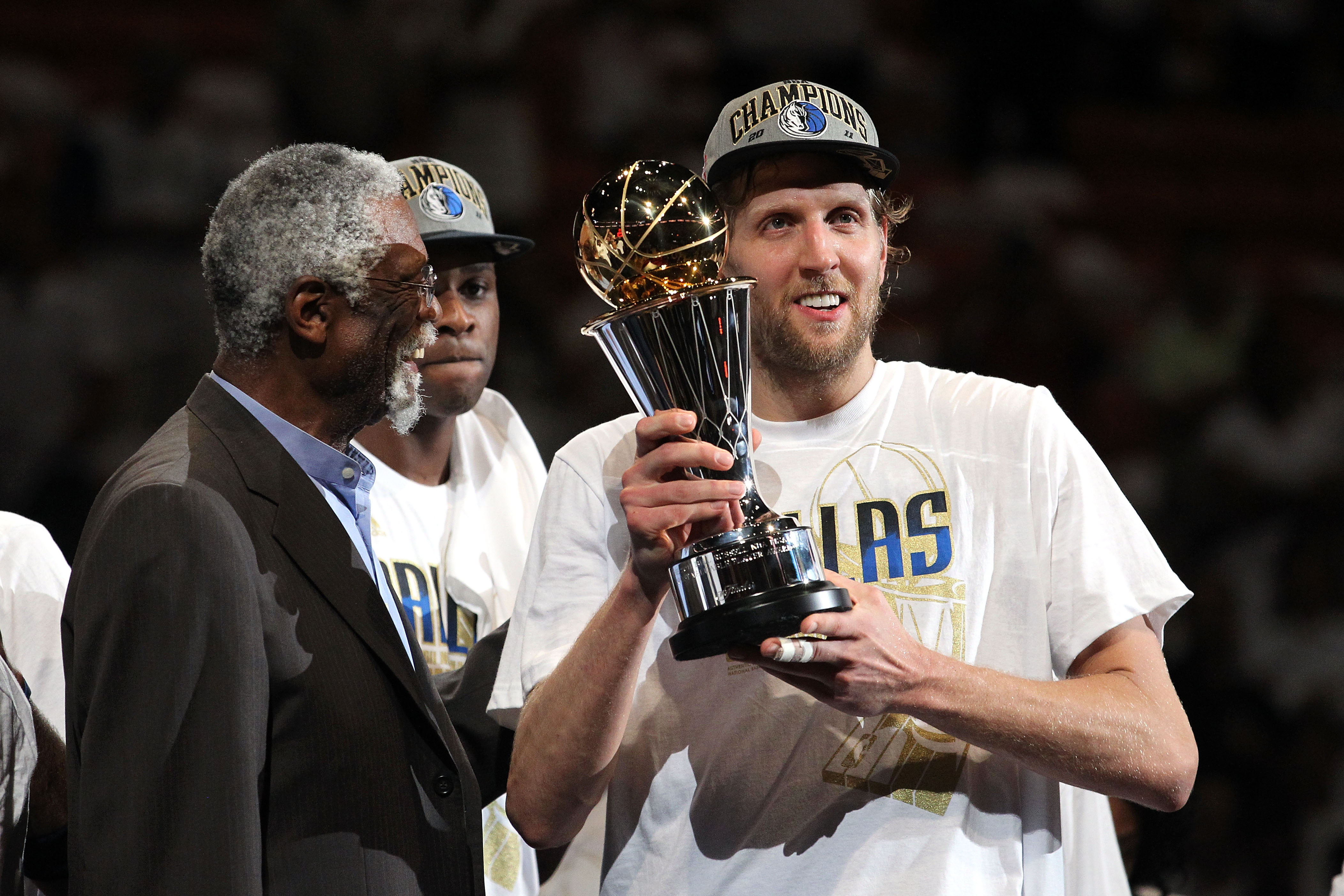 Dirk Nowitzki with the 2011 NBA Championship & MVP Trophies Game 6 of the  2011 NBA Finals Sports Photo - Item # VARPFSAANS093