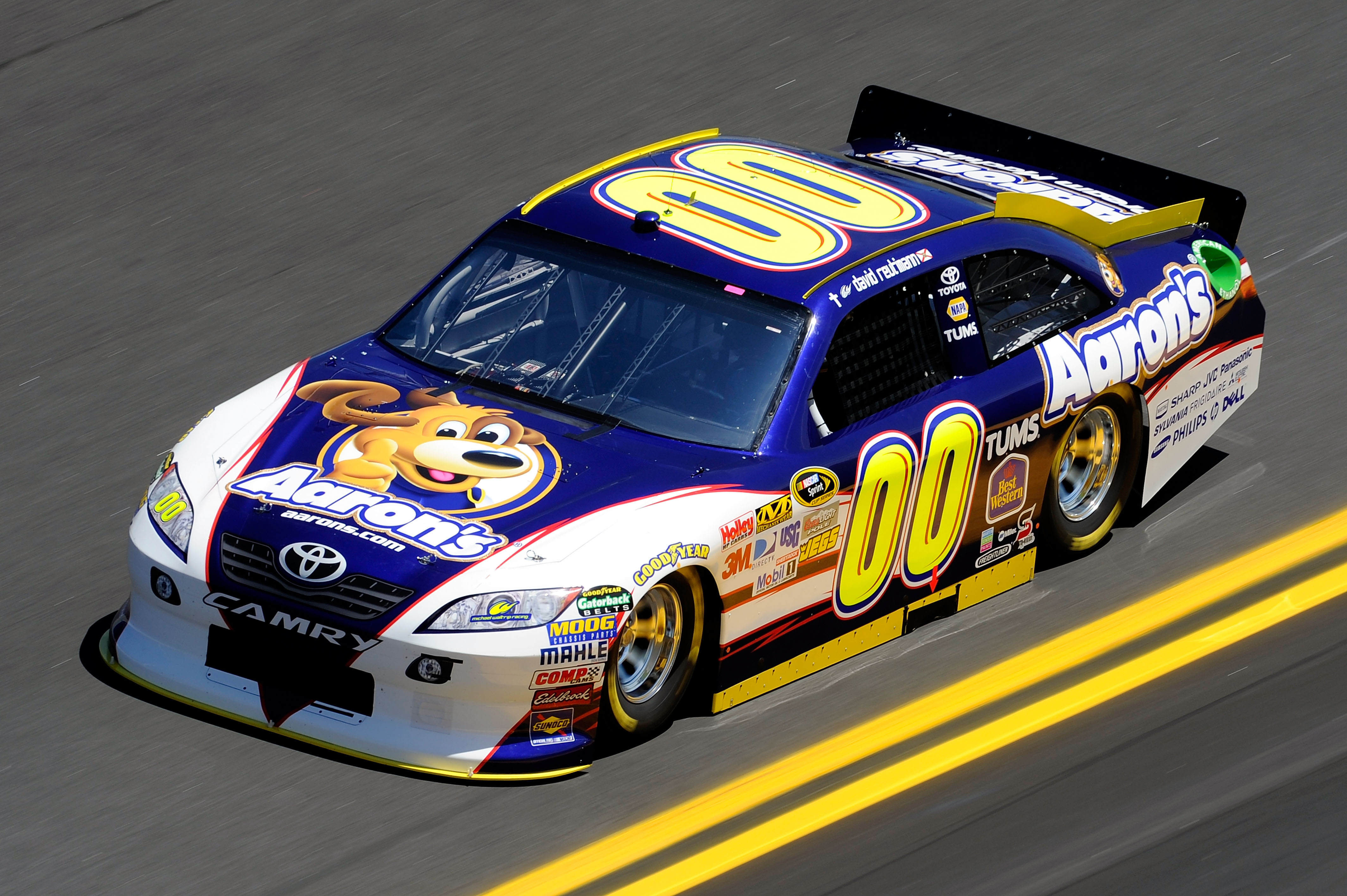 DAYTONA BEACH, FL - FEBRUARY 12:  David Reutimann, driver of the #00 Aaron's Dream Machine Toyota, practices for the NASCAR Sprint Cup Series Daytona 500 at Daytona International Speedway on February 12, 2011 in Daytona Beach, Florida.  (Photo by John Har