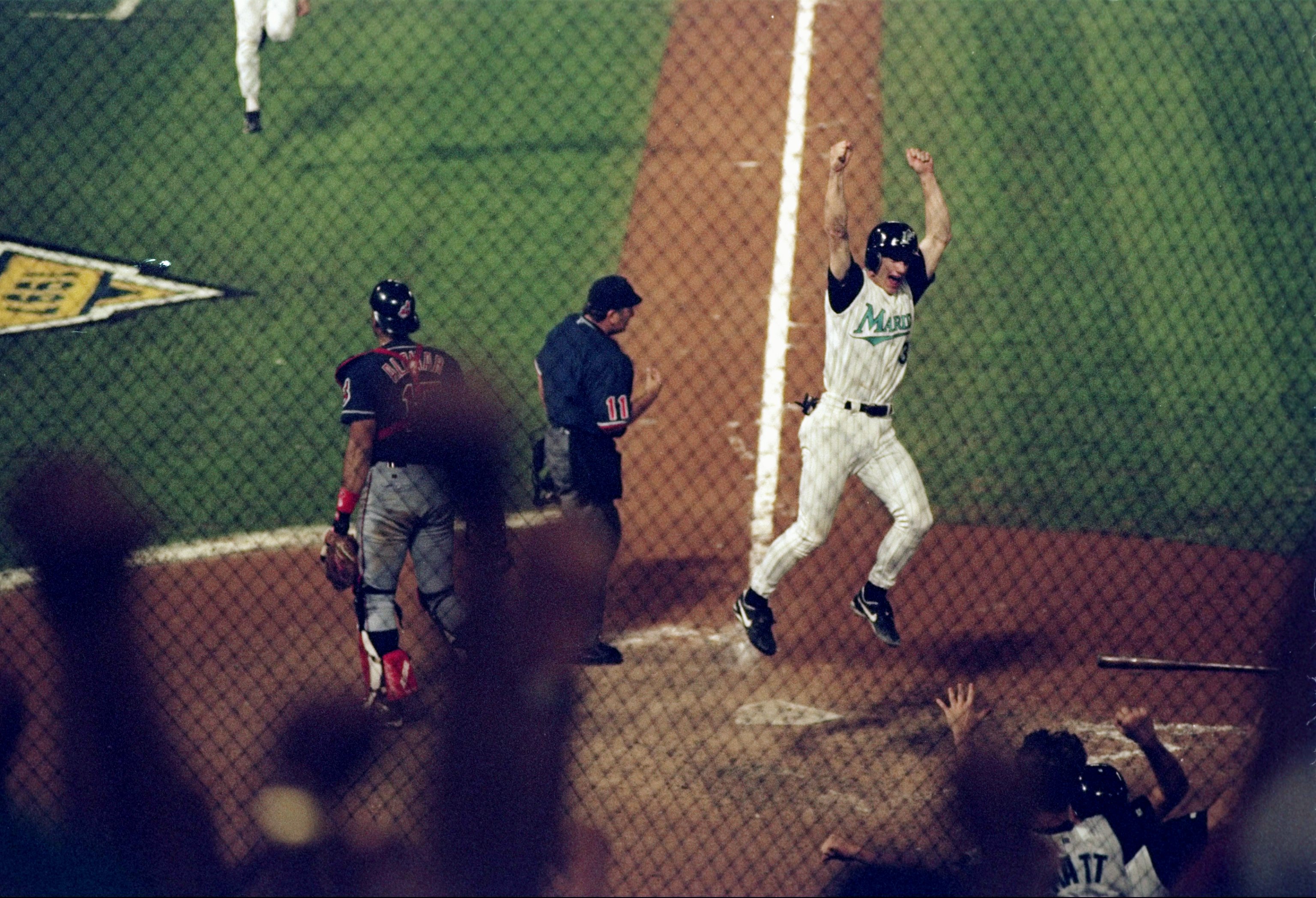 26 Oct 1997:  Pitcher Craig Counsell of the Florida Marlins celebrate after scoring the winning run on an Edgar Renteria RBI single to defeat the Cleveland Indians 3-2 after 11 innings during Game 7 of the 1997 World Series at Pro Player Stadium in Miami,