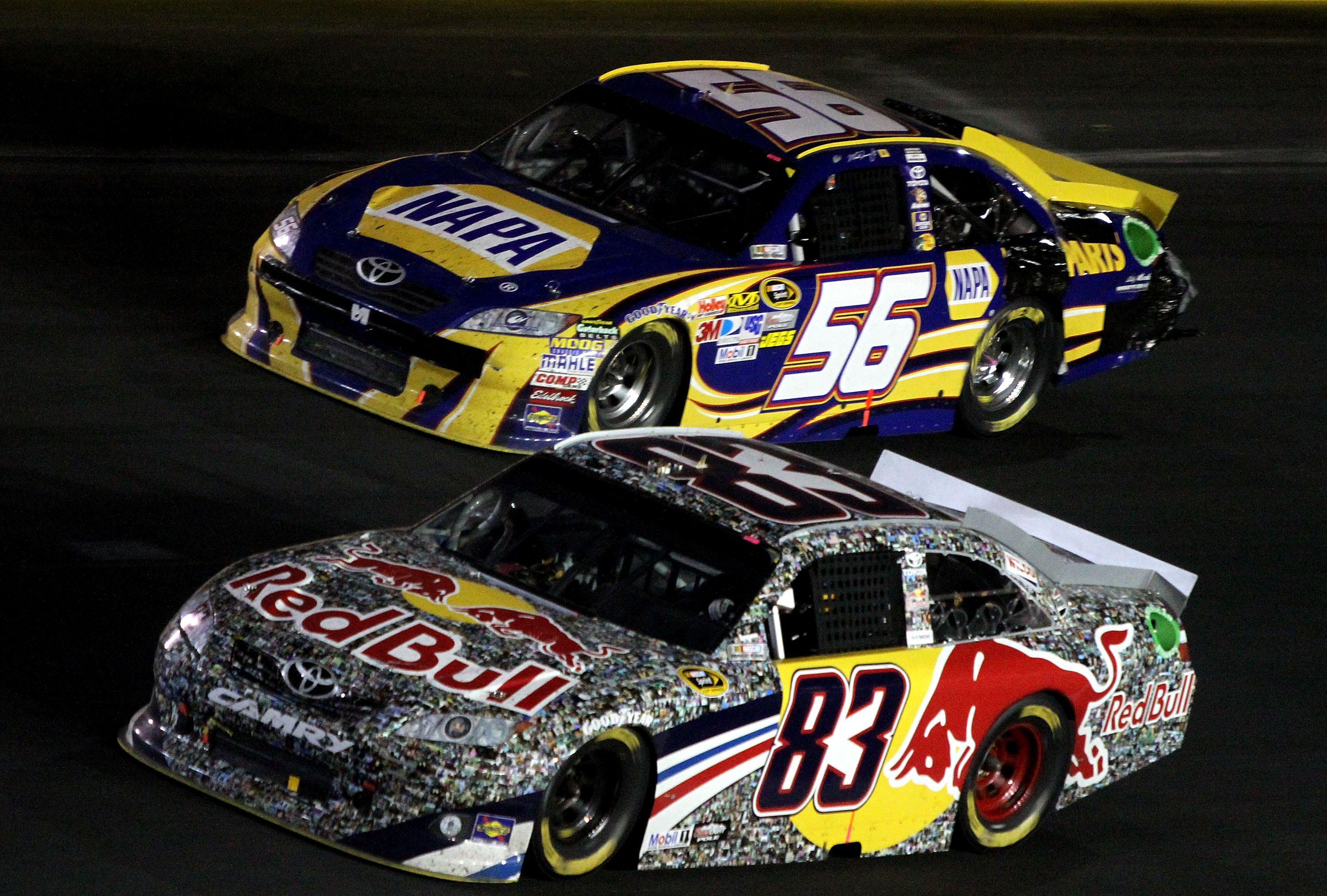 CONCORD, NC - MAY 29:  Brian Vickers, driver of the #83 Red Bull Toyota, races side by side with Martin Truex Jr., driver of the #56 NAPA Auto Parts Toyota, during the NASCAR Sprint Cup Series Coca-Cola 600 at Charlotte Motor Speedway on May 29, 2011 in C