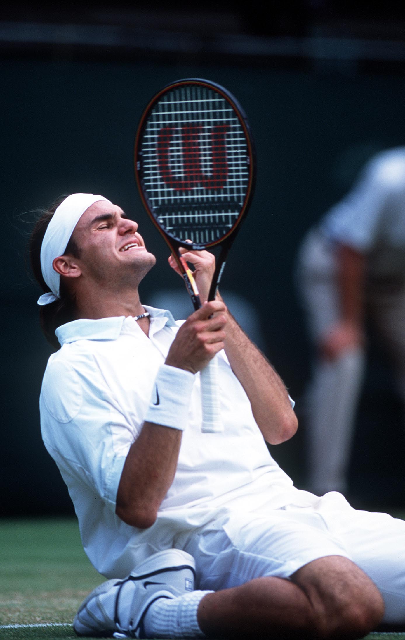 2 Jul 2001:  Roger Federer of Switzerland celebrates his victory over Pete Sampras of the USA during the men's fourth round of The All England Lawn Tennis Championship at Wimbledon, London.  DIGITAL IMAGE Mandatory Credit: Clive Brunskill/ALLSPORT