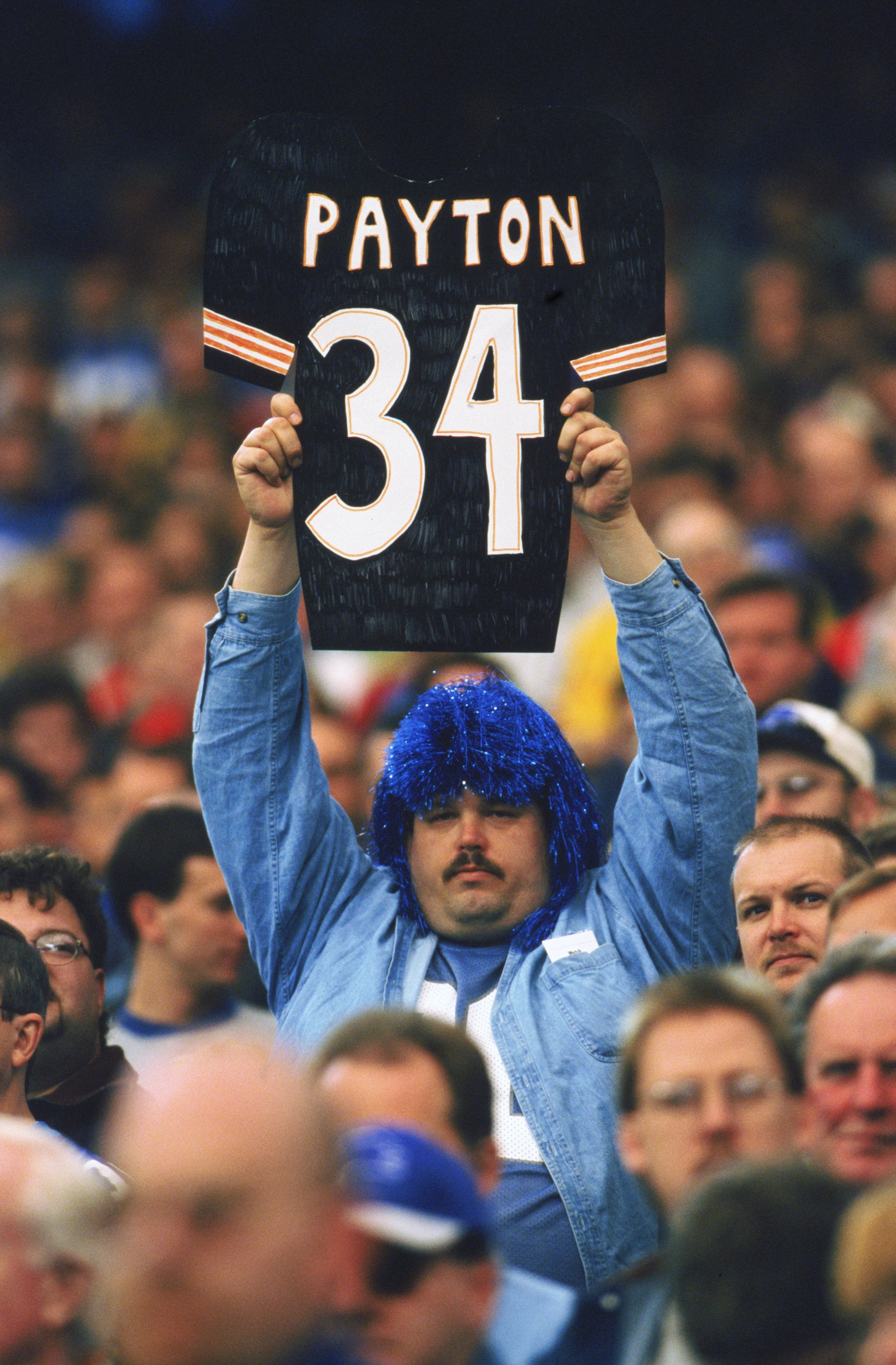 7 Nov 1999:  A fan of the the Detriot Lions holds up a Walter Payton #34 jersey sign in remembrance of Payton's passing during the game between the St. Louis Rams and the Detroit Lions at the Pontiac Silverdome in Pontiac, Michigan. The Lions defeated the
