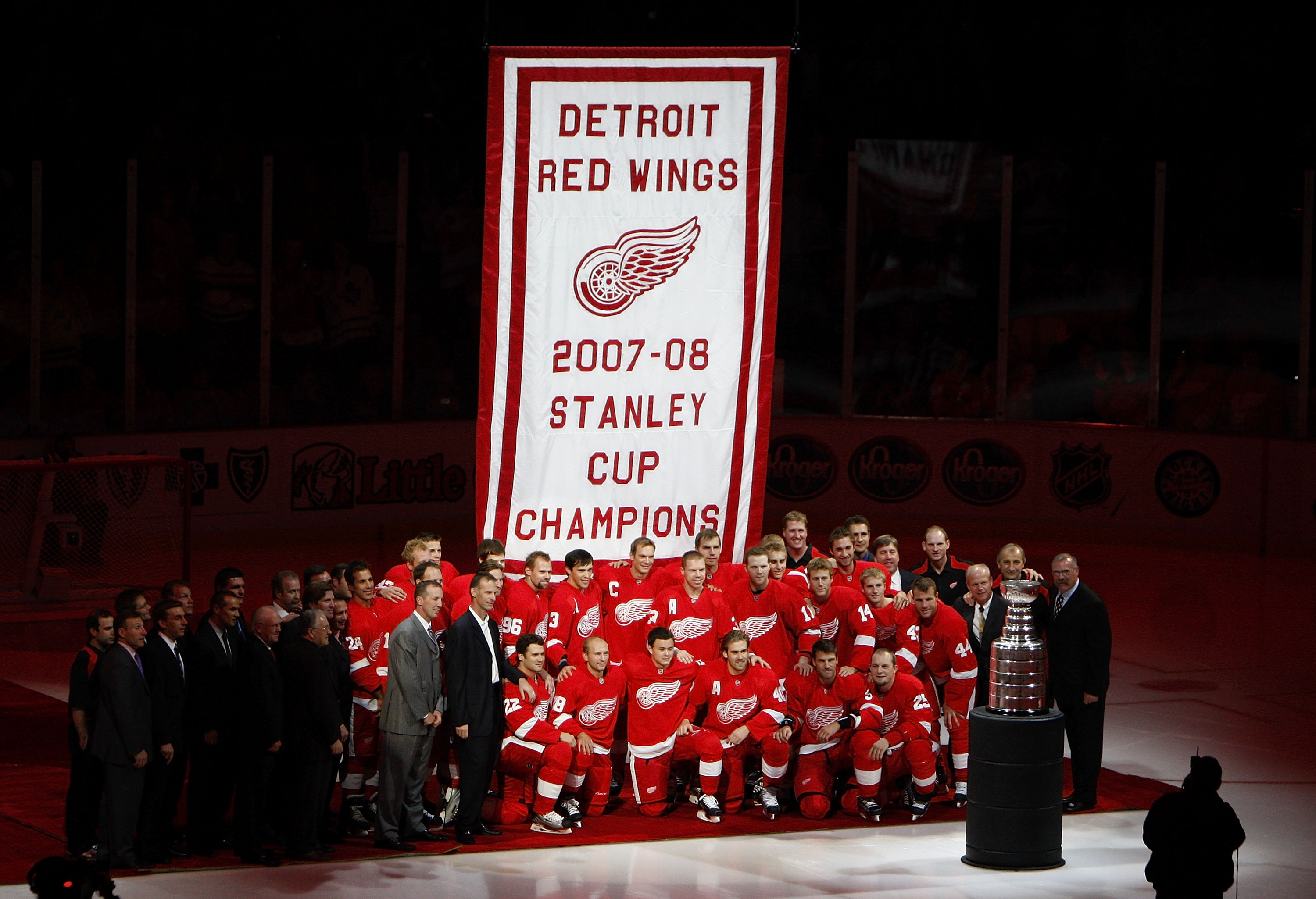 DETROIT - OCTOBER 09:  Members of the 2007-2008 Detroit Red Wings pose for a photo in front of their Stanley Cup championship banner prior to playing the Toronto Maple Leafs on October 9, 2008 at Joe Louis Arena in Detroit, Michigan.  (Photo by Gregory Sh
