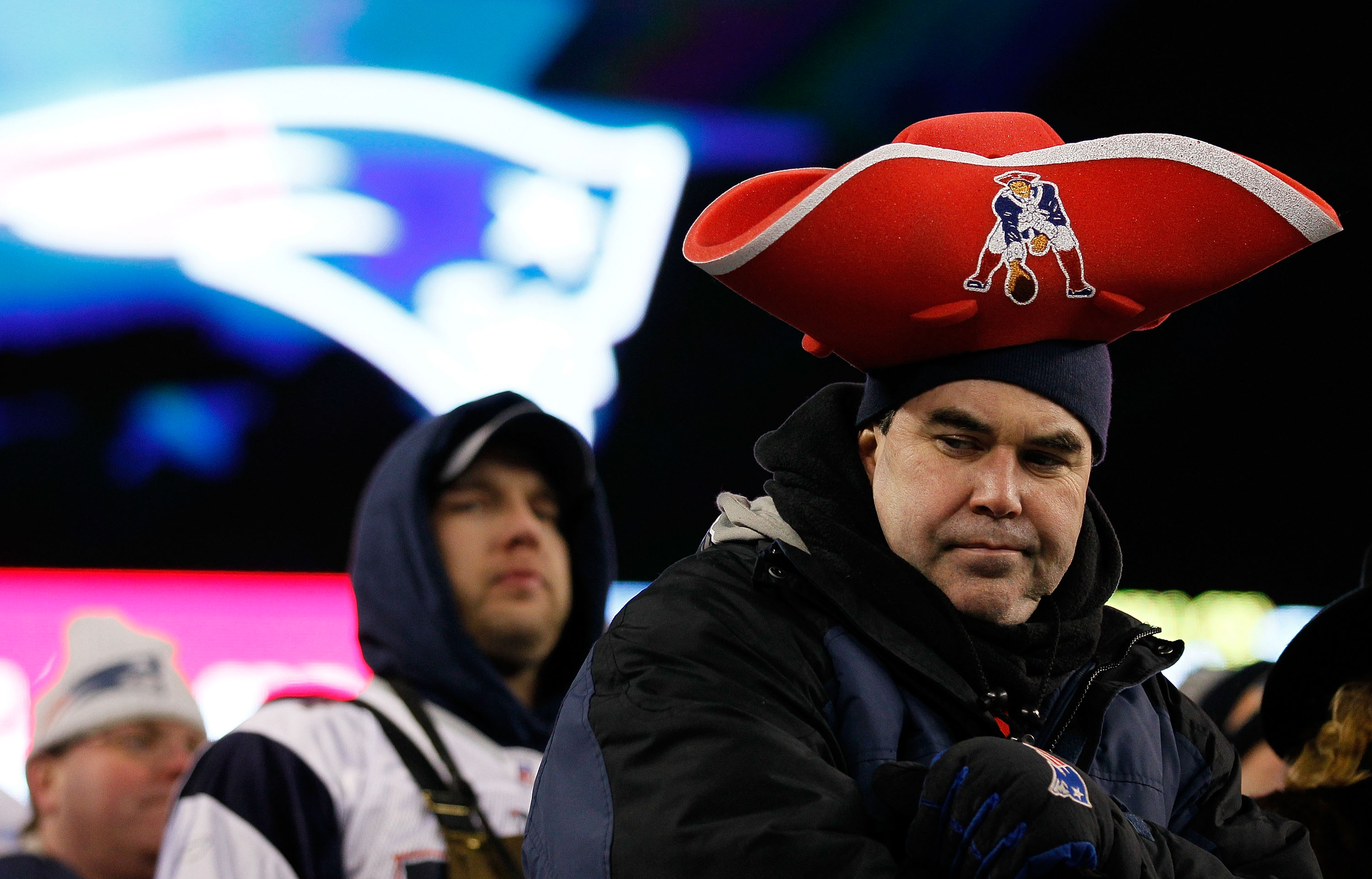 FOXBORO, MA - JANUARY 16:  A fan of the New England Patriots looks on after the Jets defeated the Patriots 28 to 21 in their 2011 AFC divisional playoff game at Gillette Stadium on January 16, 2011 in Foxboro, Massachusetts.  (Photo by Jim Rogash/Getty Im
