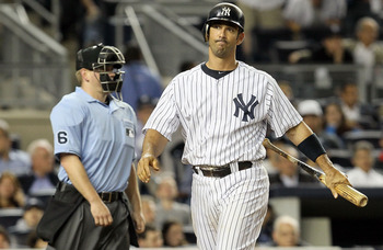 New York Yankees Jorge Posada (20) slaps hands with Alex Rodriguez