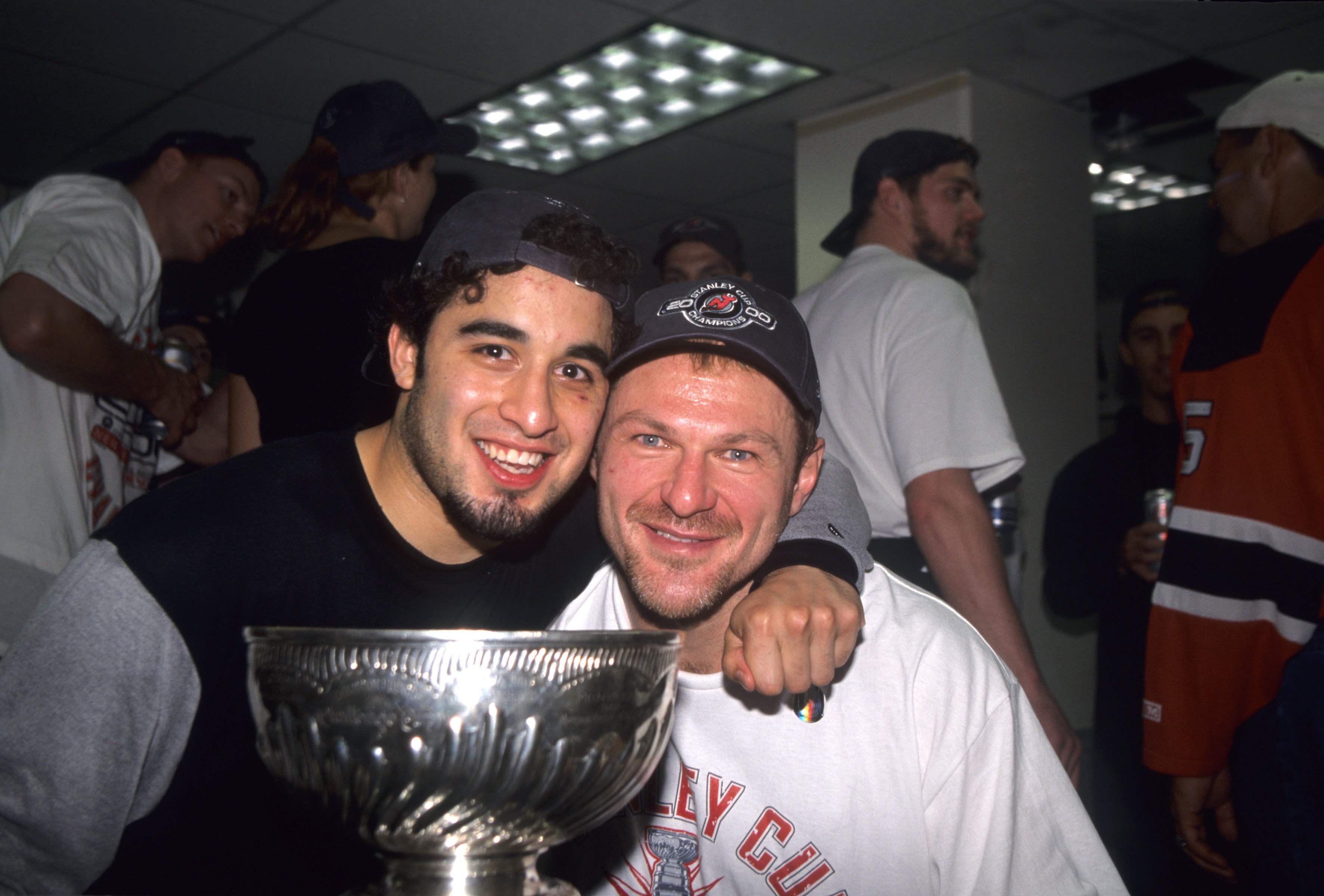 DALLAS - JUNE 10: Claude Lemieux #22 of the New Jersey Devils and Scott Gomez celebrate with the Stanley Cup Trophy after winning the 2000 Stanley Cup Finals game against the Dallas Stars at Reunion Arena on June 10, 2000 in Dallas, Texas. (Photo by: Jim