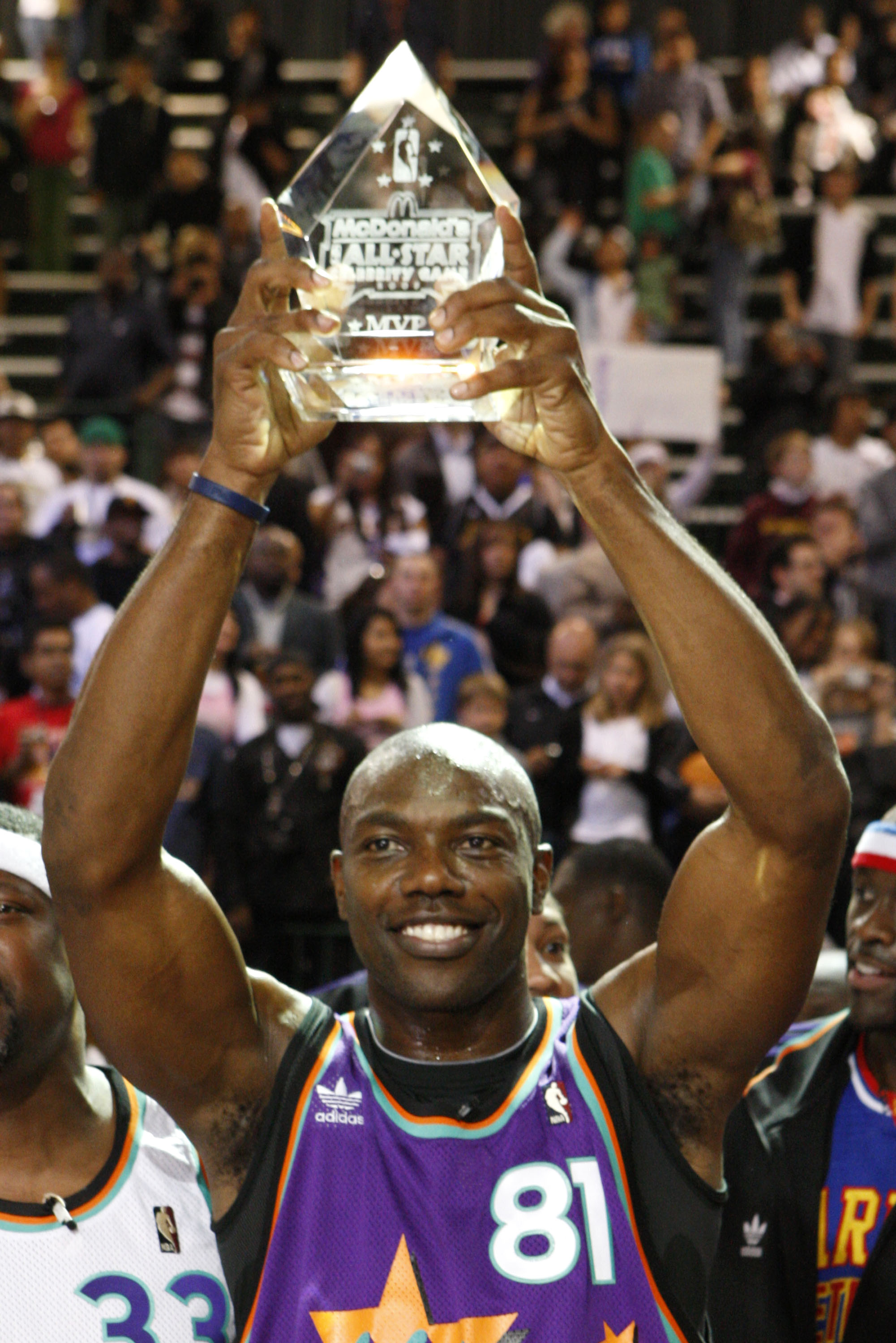 PHOENIX - FEBRUARY 13:  Terrell Owens of the Dallas Cowboys poses with his MVP trophy during the McDonald's All-Star Celebrity Game held at the Phoenix Convention Center on February 13, 2009 in Phoenix, Arizona.  (Photo by Nick Doan/Getty Images)