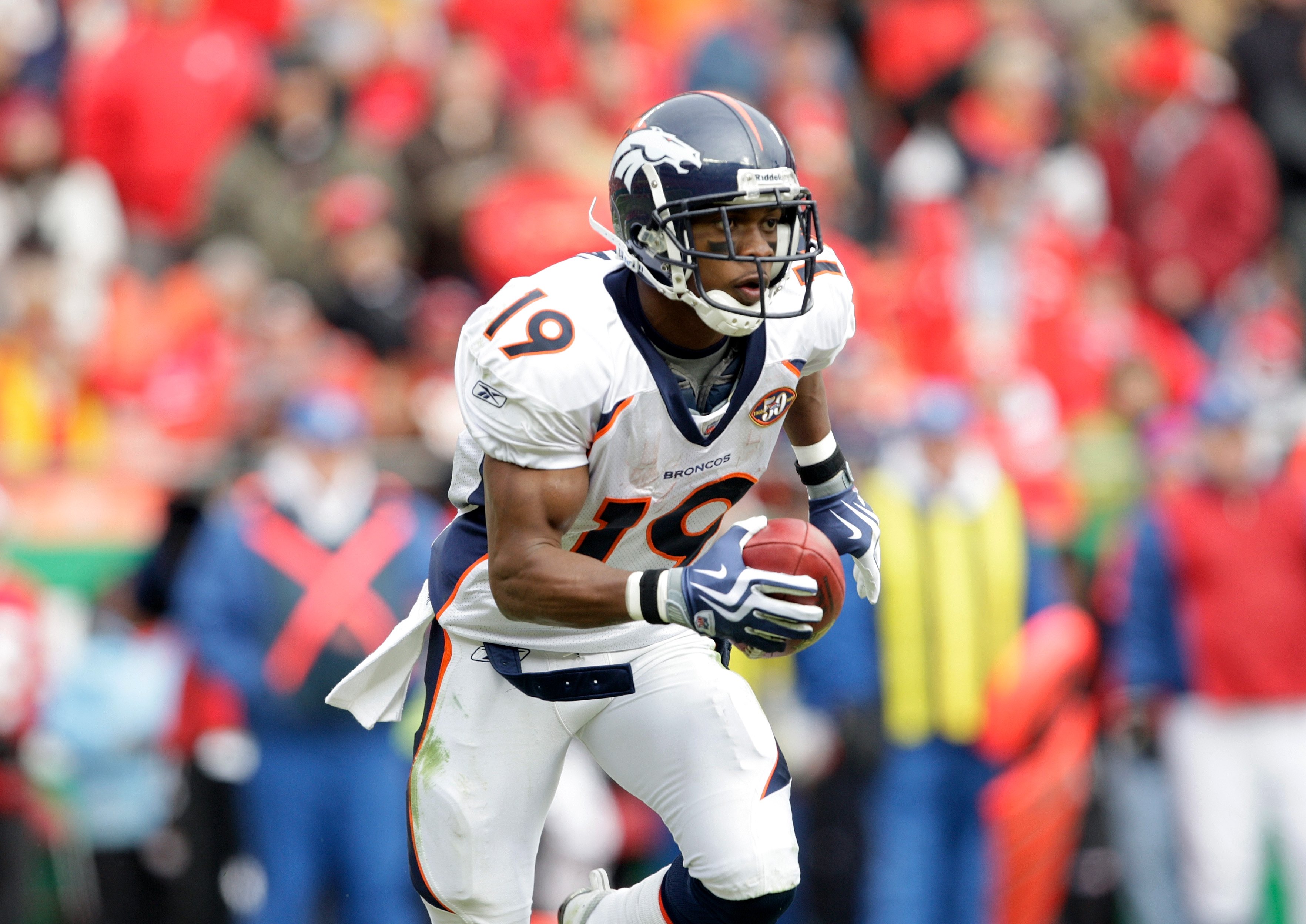 Denver Broncos wide receiver Brandon Lloyd looks on against the New York  Jets during the second half of an NFL football game Sunday, Oct. 17, 2010,  in Denver. (AP Photo/Joe Mahoney Stock