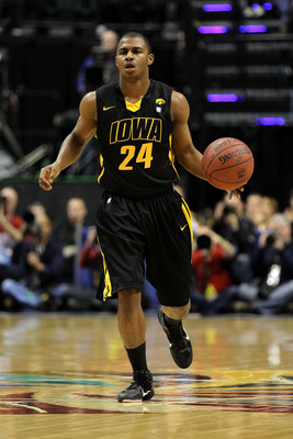 INDIANAPOLIS, IN - MARCH 10: Bryce Cartwright #24 of the Iowa Hawkeyes brings the ball up court against the Michigan State Spartans during the first round of the 2011 Big Ten Men's Basketball Tournament at Conseco Fieldhouse on March 10, 2011 in Indianap