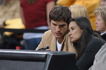 IOWA CITY, IA - DECEMBER 12: Actors Ashton Kutcher and wife Demi Moore watch the second half of the game during the Iowa-Iowa State college basketball game on December 12, 2008 at the University of Iowa in Iowa City, Iowa. Johnson and Kutcher, both from