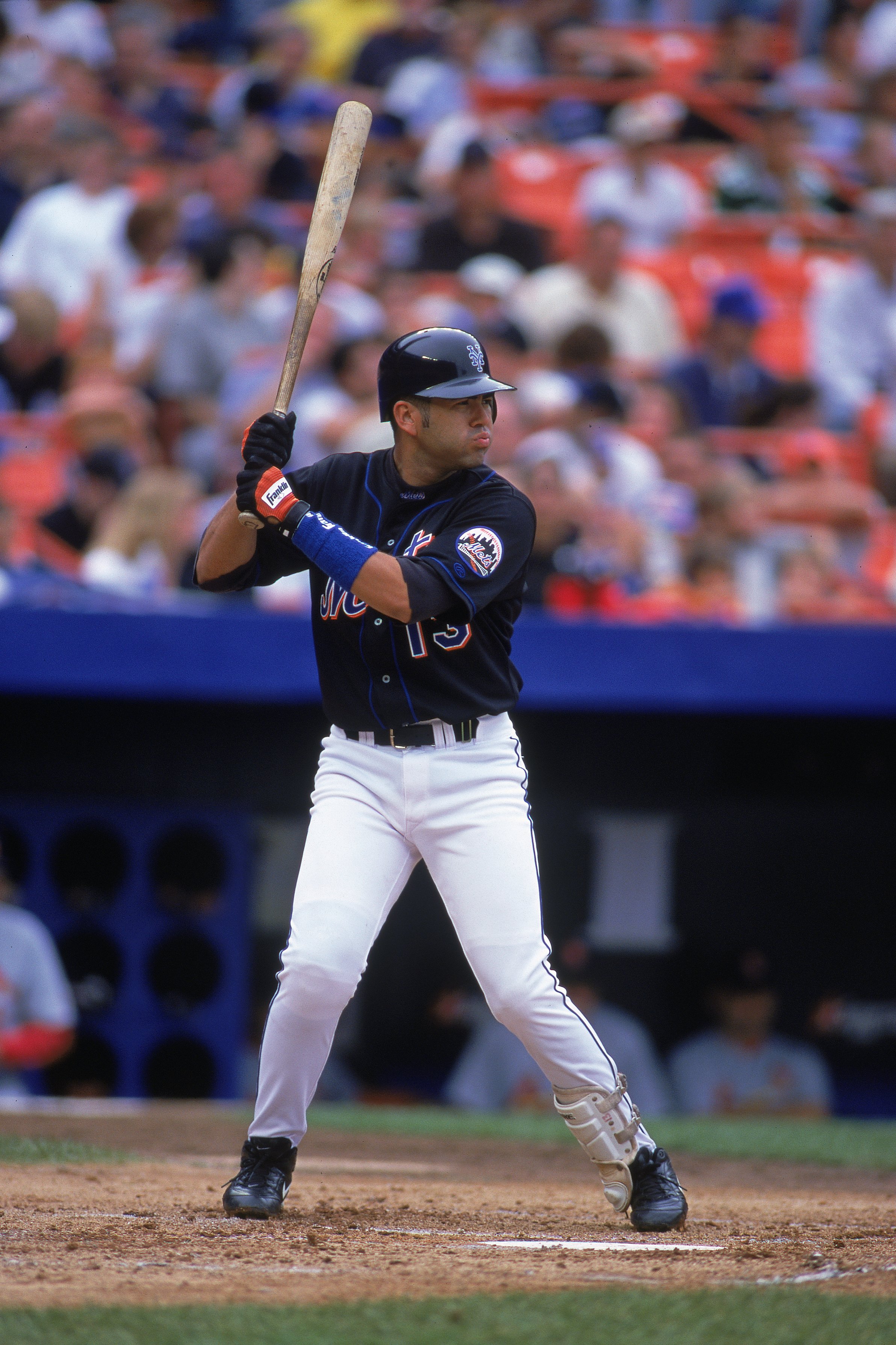 31 Jul 2000:  Edgardo Alfonzo #13 of the New York Mets at bat in the infield during the game against the St. Louis Cardinals at Shea Stadium in Flushing, New York. The Mets defeated the Cardinals 4-2.Mandatory Credit: Al Bello  /Allsport