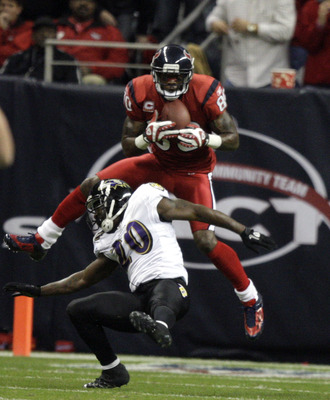 HOUSTON, TX - DECEMBER 13:  Wide receiver Andre Johnson #80 of the Houston Texans scores on a pass as he goes over safety Ed Reed #20 of the Baltimore Ravens in the second quarter at Reliant Stadium on December 13, 2010 in Houston, Texas.  (Photo by Bob L