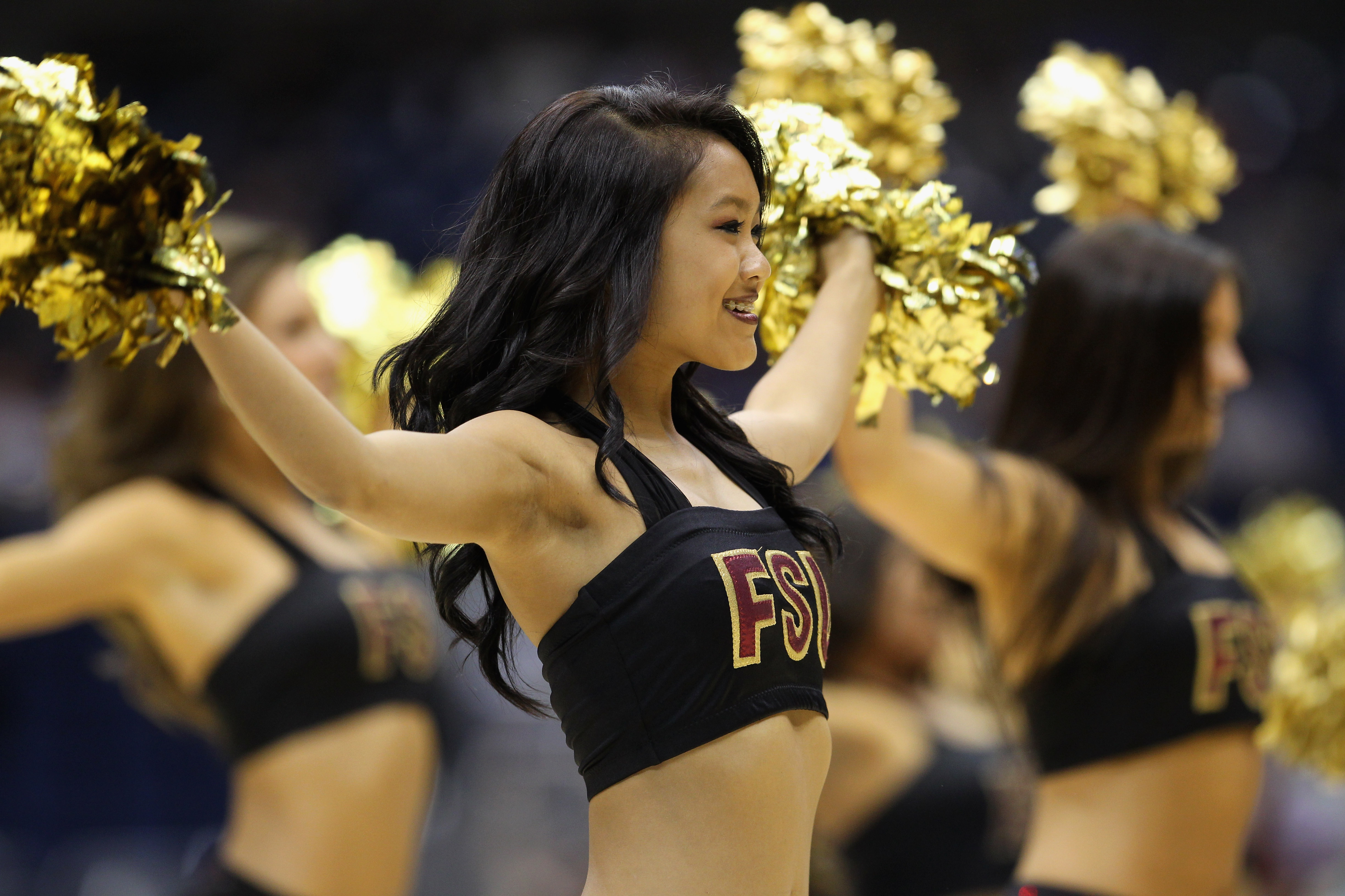SAN ANTONIO, TX - MARCH 25:  Florida State Seminoles cheerleaders perform during the southwest regional of the 2011 NCAA men's basketball tournament against the Virginia Commonwealth Rams at the Alamodome on March 25, 2011 in San Antonio, Texas. Virginia