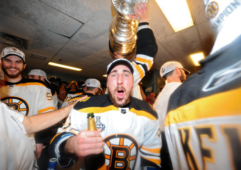 VANCOUVER, BC - JUNE 15:  Brad Marchand #63 of the Boston Bruins celebrates in the locker room after defeating the Vancouver Canucks in Game Seven of the 2011 NHL Stanley Cup Final at Rogers Arena on June 15, 2011 in Vancouver, British Columbia, Canada. T