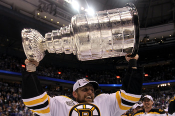 VANCOUVER, BC - JUNE 15:  Dennis Seidenberg #44 of the Boston Bruins celebrates with the Stanley Cup after defeating the Vancouver Canucks in Game Seven of the 2011 NHL Stanley Cup Final at Rogers Arena on June 15, 2011 in Vancouver, British Columbia, Can