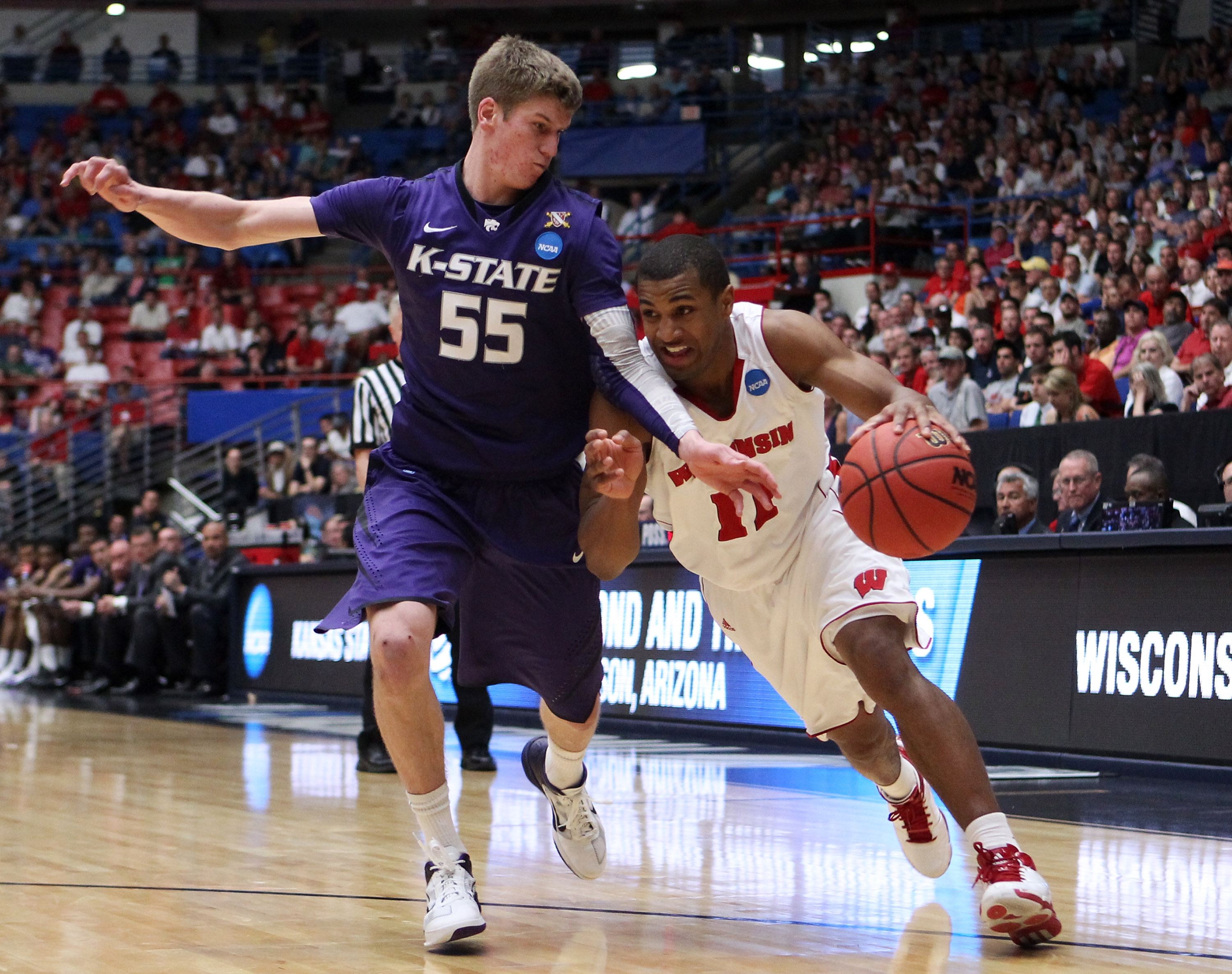 TUCSON, AZ - MARCH 19:  Jordan Taylor #11 of the Wisconsin Badgers drives past Will Spradling #55 of the Kansas State Wildcats during the third round of the 2011 NCAA men's basketball tournament at McKale Center on March 19, 2011 in Tucson, Arizona.  (Pho