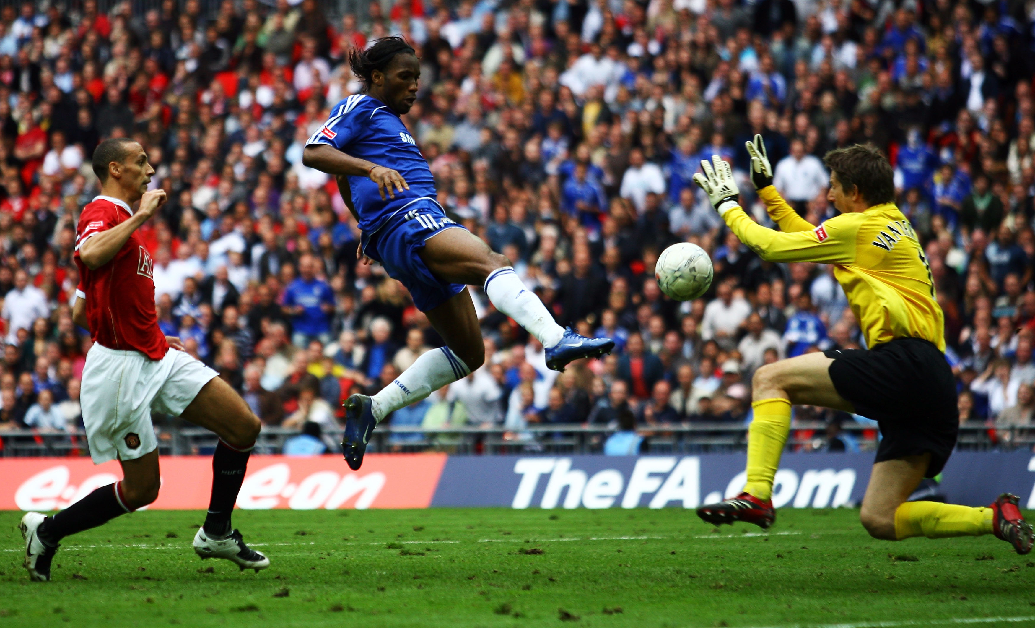 LONDON - MAY 19:  Didier Drogba of Chelsea beats Edwin Van der Sar of Manchester United to score their first goal during the FA Cup Final match sponsored by E.ON between Manchester United and Chelsea at Wembley Stadium on May 19, 2007 in London, England.