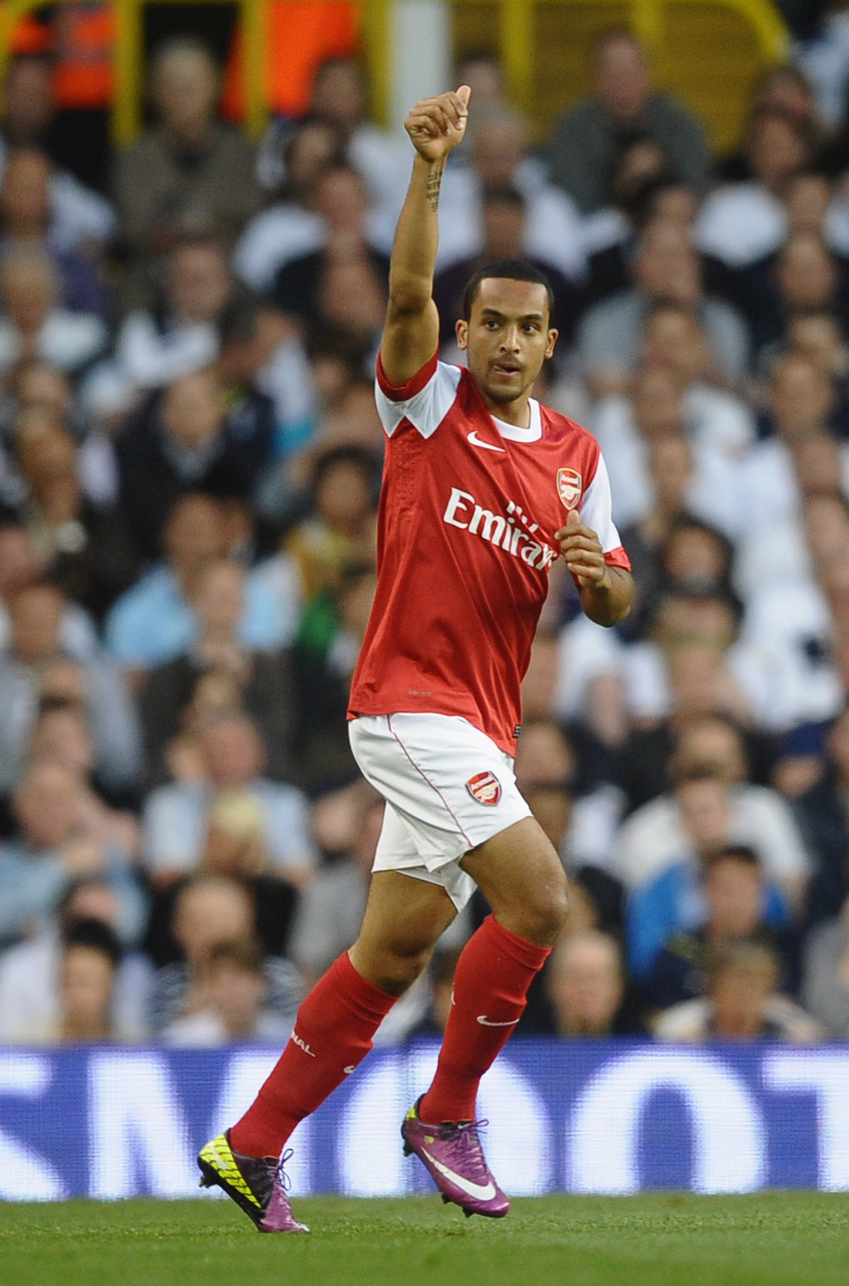 LONDON, ENGLAND - APRIL 20:  Theo Walcott of Arsenal celebrates scoring the opening goal during the Barclays Premier League match between Tottenham Hotspur and Arsenal at White Hart Lane on April 20, 2011 in London, England.  (Photo by Laurence Griffiths/