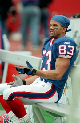 17 Oct 1999:  Andre Reed #83 of the Buffalo Bills looks on from the bench during the game against the Oakland Raiders at the Ralph Wilson Stadium in Orchard Park, New York. The Raiders defeated the Bills 20-14. Mandatory Credit: Rick Stewart  /Allsport