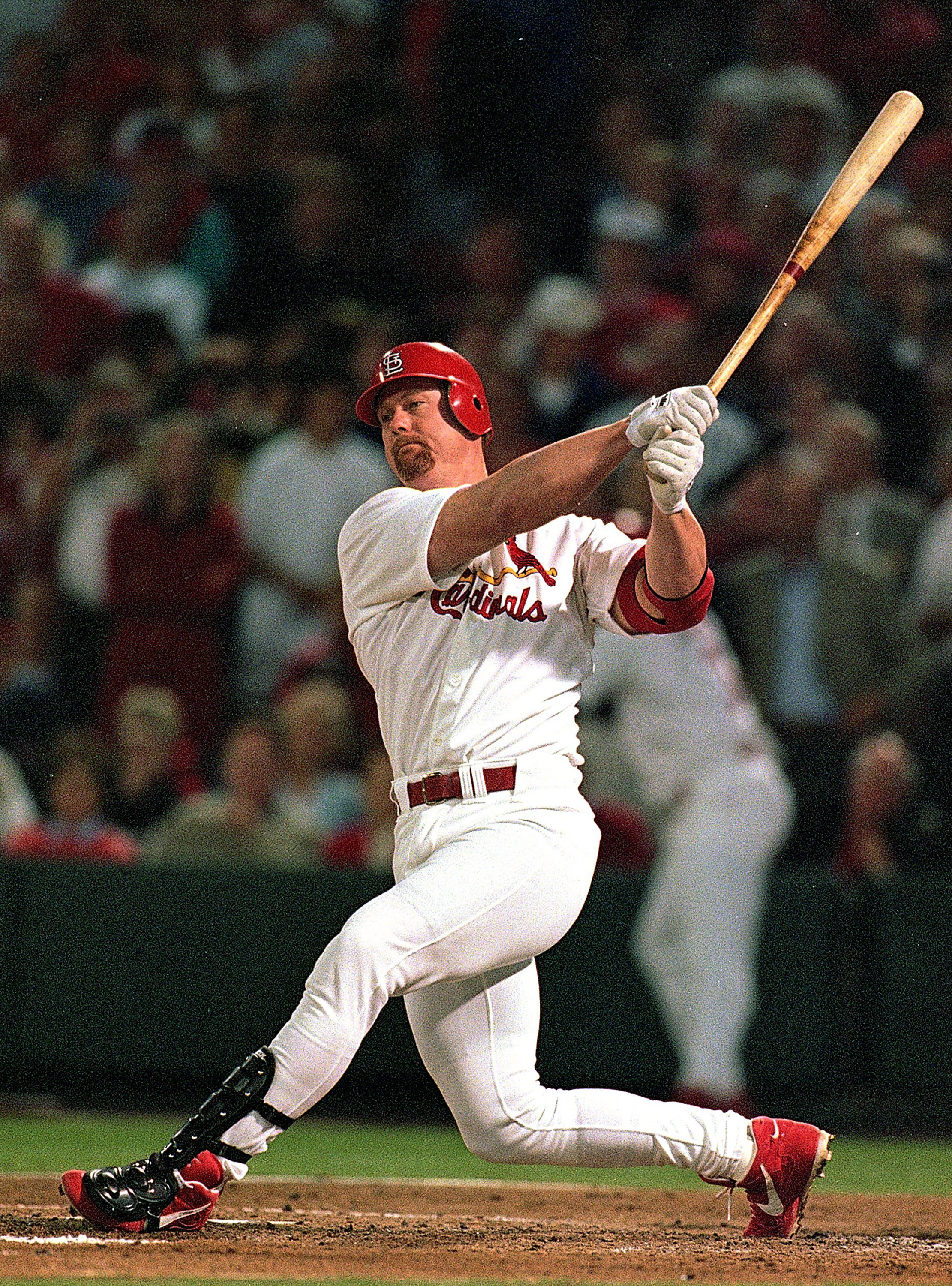 23 Sep 1998: (FILE PHOTO)  Mark McGwire #25 of the St. Louis Cardinals hits the ball during the game against the Houston Astros at Busch Stadium in St. Louis, Missouri. According to reports January 11, 2010, McGwire has admitted to steroid use during whil