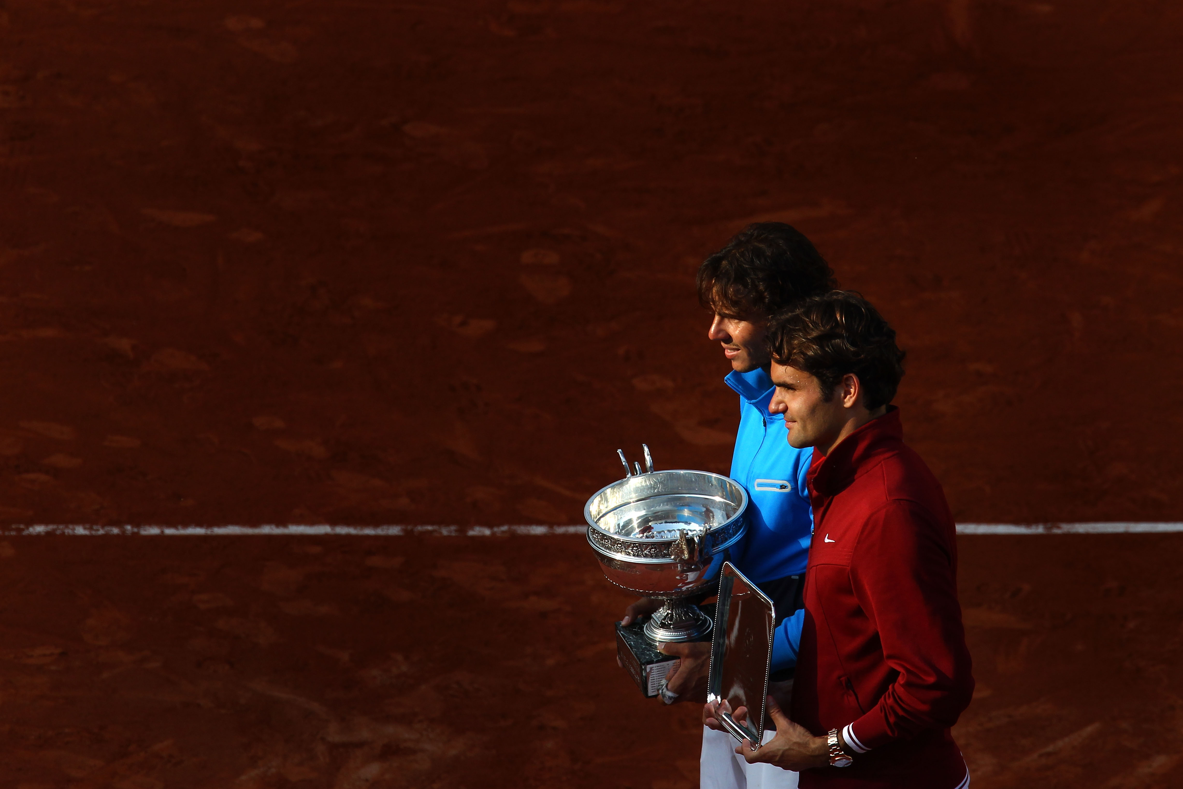 PARIS, FRANCE - JUNE 05:  (L to R) Champion Rafael Nadal of Spain and runner up Roger Federer of Switzerland pose following the men's singles final match between Rafael Nadal of Spain and Roger Federer of Switzerland on day fifteen of the French Open at R