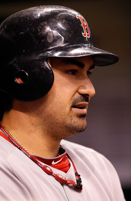 ST. PETERSBURG, FL - JUNE 14:  Infielder Adrian Gonzalez #28 of the Boston Red Sox waits to bat against the Tampa Bay Rays during the game at Tropicana Field on June 14, 2011 in St. Petersburg, Florida.  (Photo by J. Meric/Getty Images)