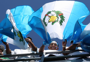 SAN DIEGO - JUNE 28:  Guatemala fans cheer and wave their flag before their team played Mexico in an international friendly match at Qualcomm Stadium on June 28, 2009 in San Diego, California.  (Photo by Stephen Dunn/Getty Images)