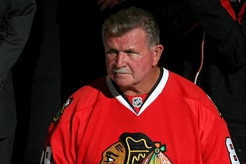 CHICAGO - APRIL 18:  Chicago Bears legend and Pro football Hall of Famer Mike Ditka stands on the ice prior to dropping the puck for the ceremonial face off between the Chicago Blackhawks and the Calgary Flames during Game Two of the Western Conference Qu