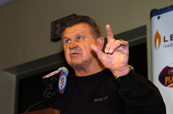 NFL Pro Football Hall of Famer Mike Ditka helps present Jerome Bettis with the Levitra Play of the year Award at the Jacksonville Convention Center on February 2, 2005  (Photo by Al Messerschmidt/Getty Images)