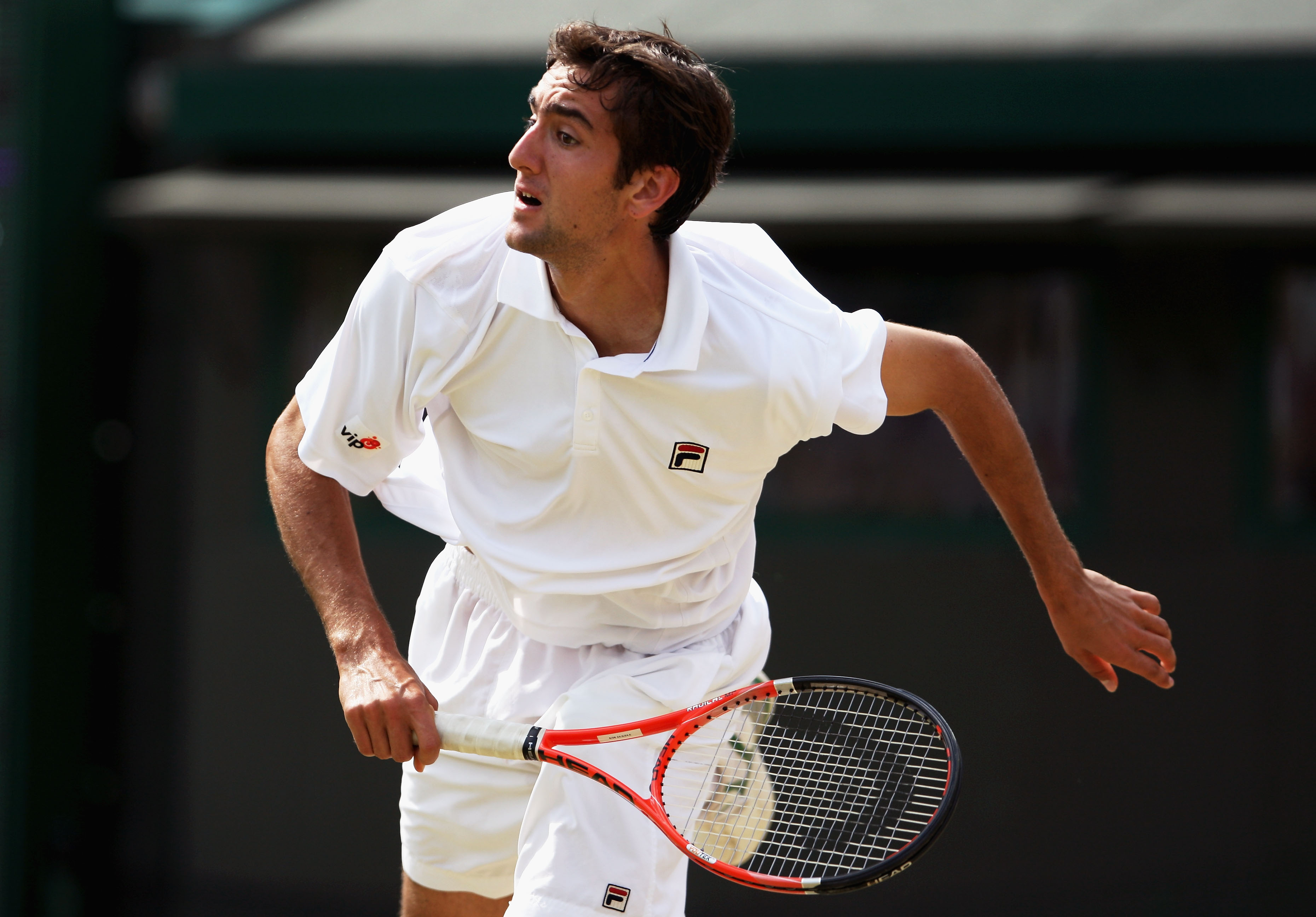 WIMBLEDON, ENGLAND - JUNE 27:  Marin Cilic of Croatia serves during the men's singles third round match against Tommy Haas of Germany on Day Six of the Wimbledon Lawn Tennis Championships at the All England Lawn Tennis and Croquet Club on June 27, 2009 in