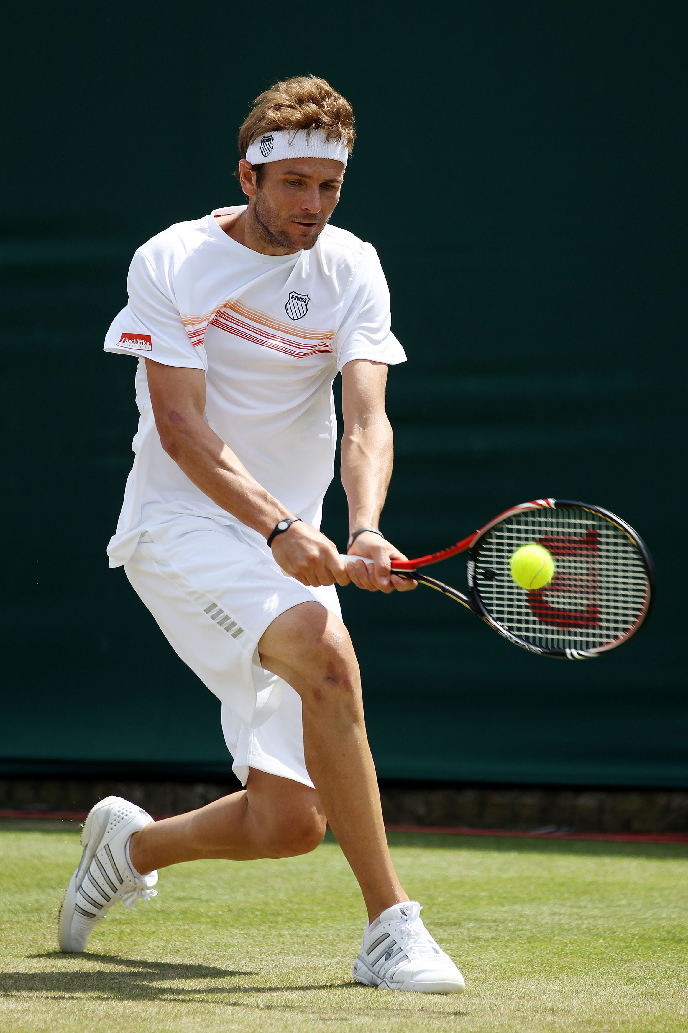 LONDON, ENGLAND - JUNE 23:  Mardy Fish of USA plays a shot during his second round match against Florian Mayer of Germany on Day Three of the Wimbledon Lawn Tennis Championships at the All England Lawn Tennis and Croquet Club on June 23, 2010 in London, E