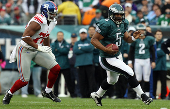 New York Giants Osi Umenyiora (72) sacks Philadelphia Eagles quarterback  Donovan McNabb on the Philadelphia 30-yard line during first quarter play  at Philadelphia's Lincoln Field December 9, 2007.Helping him is teammate  Giants