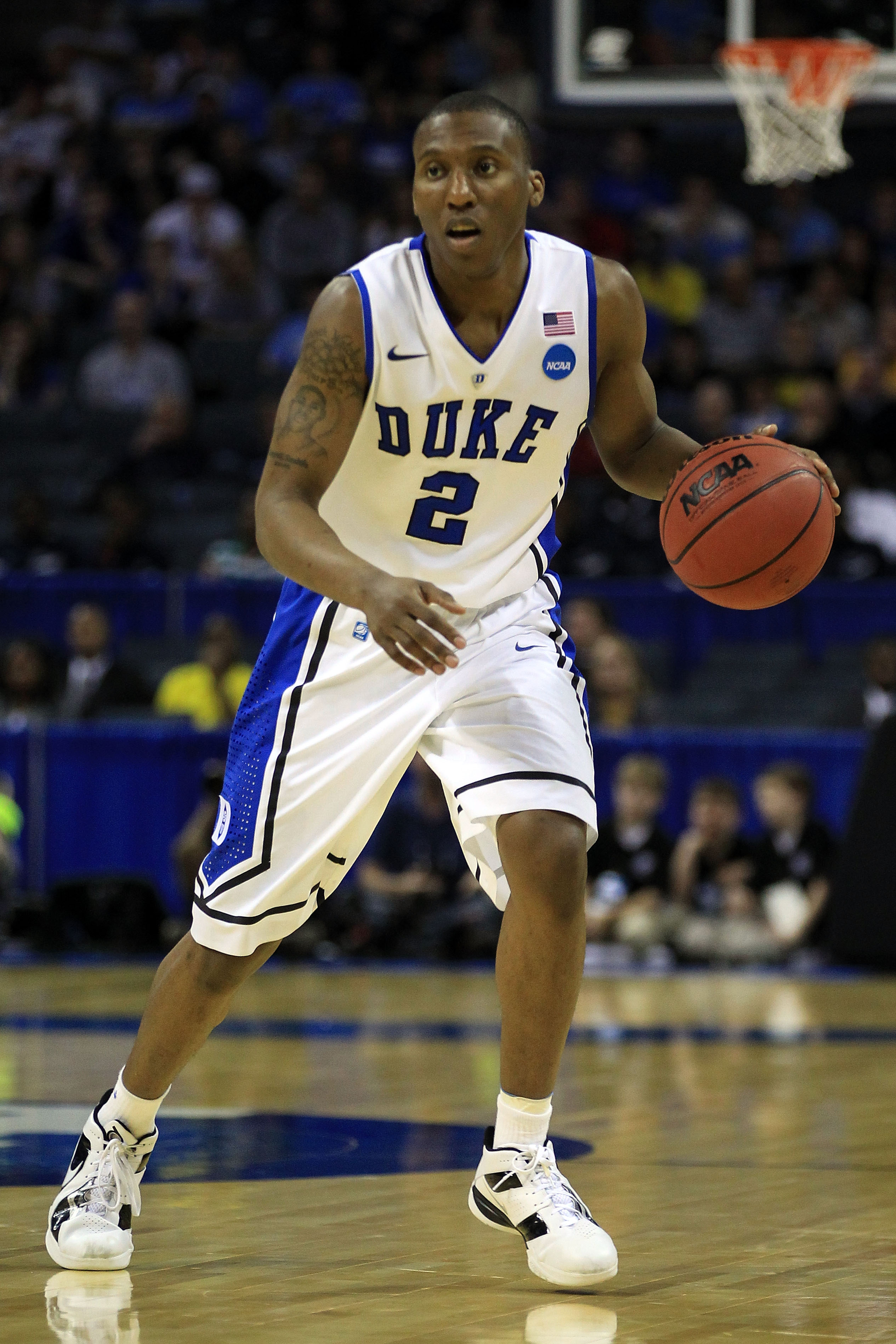 CHARLOTTE, NC - MARCH 20:  Nolan Smith #2 of the Duke Blue Devils moves the ball while taking on the Michigan Wolverines during the third round of the 2011 NCAA men's basketball tournament at Time Warner Cable Arena on March 20, 2011 in Charlotte, North C