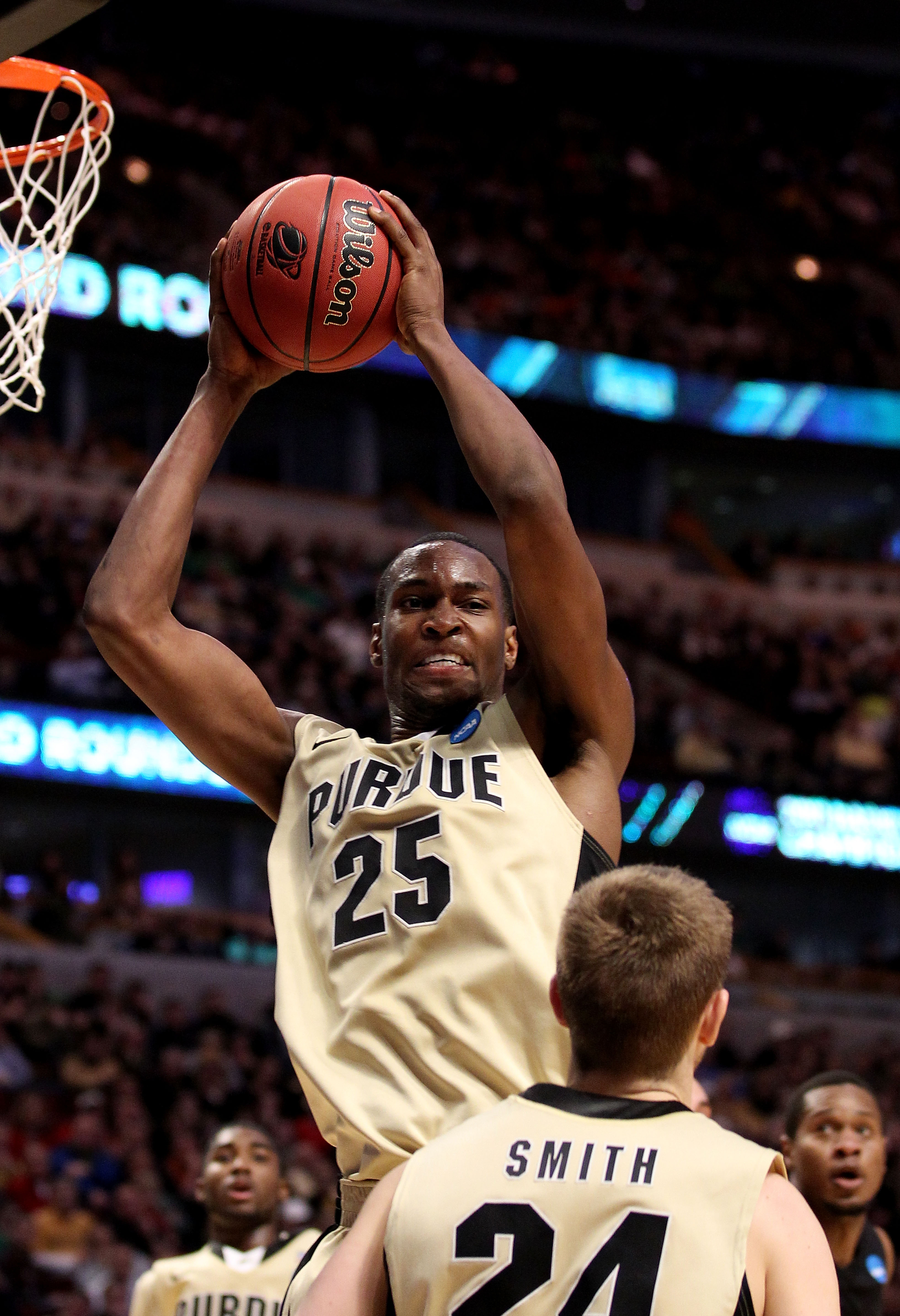 CHICAGO, IL - MARCH 20:  JaJuan Johnson #25 of the Purdue Boilermakers rebounds against the Virginia Commonwealth Rams in the second half during the third round of the 2011 NCAA men's basketball tournament at the United Center on March 20, 2011 in Chicago