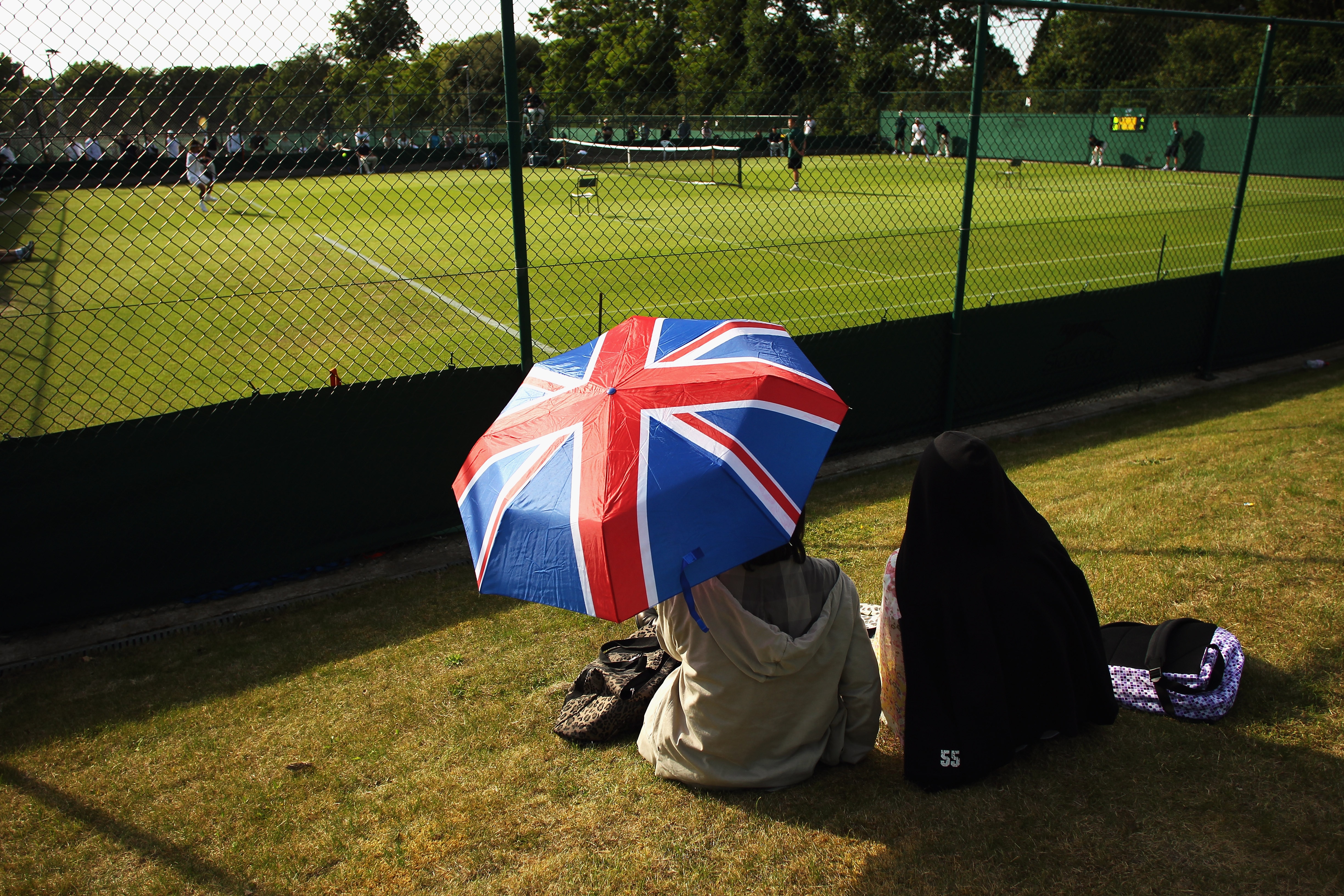 LONDON, ENGLAND - JUNE 14: Spectators enjoy day two of the Wimbledon Championships 2011 Qualifying at the Bank of England Sports Ground on June 14, 2011 in London, England. (Photo by Bryn Lennon/Getty Images)