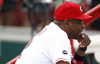 CINCINNATI, OH - JUNE 17:  Manager Dusty Baker #12 of the Cincinnati Reds watches his team during the game against the Toronto Blue Jays on June 17, 2011 at Great American Ball Park in Cincinnati, Ohio.  The Toronto Blue Jays defeated the Cincinnati Reds 