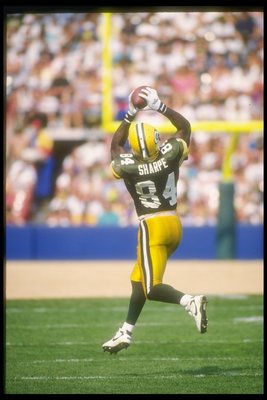 11 Sep 1994:  Wide receiver Sterling Sharpe of the Green Bay Packers catches the ball during a game against the Miami Dolphins at Milwaukee County Stadium in Milwaukee, Wisconsin.  The Dolphins won the game, 24-14. Mandatory Credit: Jonathan Daniel  /Alls
