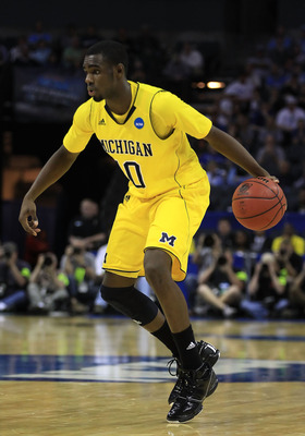 CHARLOTTE, NC - MARCH 20: Tim Hardaway Jr. #10 of the Michigan Wolverines moves the ball while taking on the Duke Blue Devils during the third round of the 2011 NCAA men's basketball tournament at Time Warner Cable Arena on March 20, 2011 in Charlotte, N