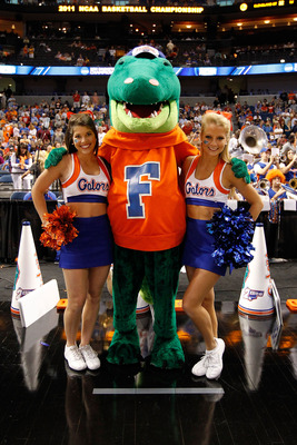 TAMPA, FL - MARCH 19:  Albert, the mascot for the Florida Gators, poses for a photo with 2 FLorida cheerleaders against the UCLA Bruins during the third round of the 2011 NCAA men's basketball tournament at St. Pete Times Forum on March 19, 2011 in Tampa,