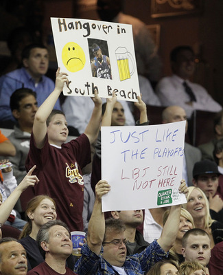 CLEVELAND - OCTOBER 27:  Fans of the Cleveland Cavaliers hold up signs expressing their thoughts about LeBron James while playing the Boston Celtics at Quicken Loans Arena on October 27, 2010 in Cleveland, Ohio.  (Photo by Gregory Shamus/Getty Images)