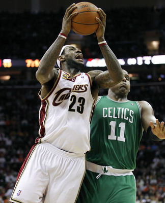 CLEVELAND - MAY 11:  LeBron James #23 of the Cleveland Cavaliers tries to get a shot off around Glen Davis #11 of the Boston Celtics during Game Five of the Eastern Conference Semifinals during the 2010 NBA Playoffs at Quicken Loans Arena on May 11, 2010