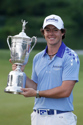 BETHESDA, MD - JUNE 19:  Rory McIlroy of Northern Ireland poses with the trophy after his eight-stroke victory on the 18th green during the 111th U.S. Open at Congressional Country Club on June 19, 2011 in Bethesda, Maryland.  (Photo by David Cannon/Getty