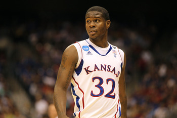 SAN ANTONIO, TX - MARCH 25:  Josh Selby #32 of the Kansas Jayhawks looks on during the southwest regional of the 2011 NCAA men's basketball tournament against the Richmond Spiders at the Alamodome on March 25, 2011 in San Antonio, Texas. Kansas defeated R