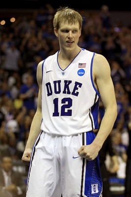 CHARLOTTE, NC - MARCH 20:  Kyle Singler #12 of the Duke Blue Devils reacts while taking on the Michigan Wolverines in the second half during the third round of the 2011 NCAA men's basketball tournament at Time Warner Cable Arena on March 20, 2011 in Charl
